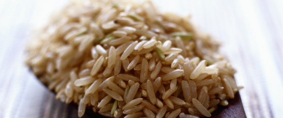 Brown rice on wooden spoon, close up